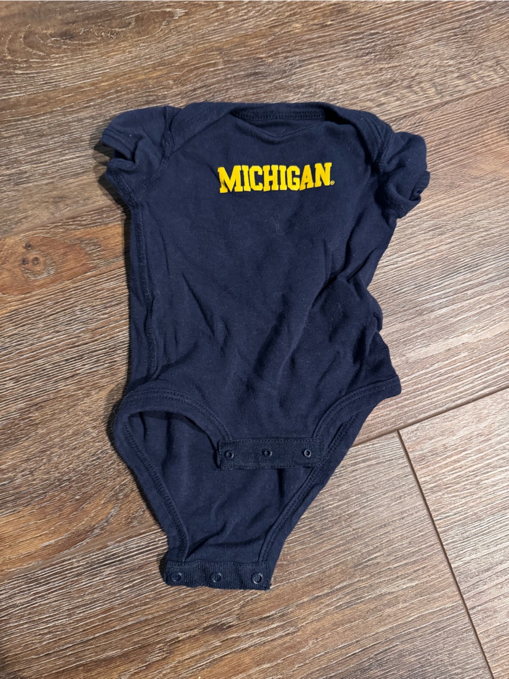 Michigan Navy Baby Onesie with Classic logo